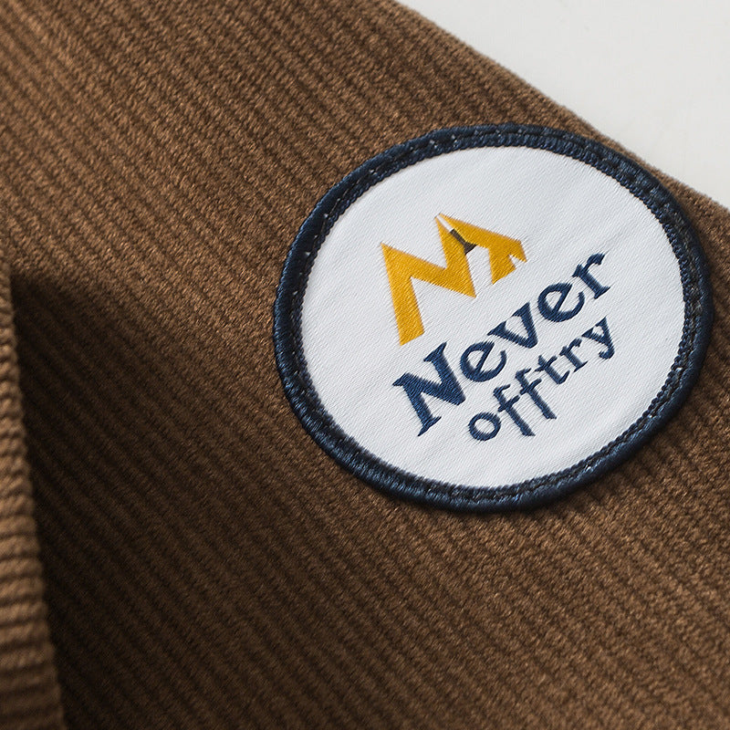 Plain corduroy coat with label decoration