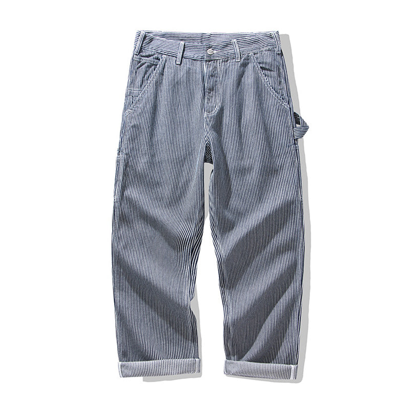 Multi-pocket work pants available in two styles: raw denim and striped denim