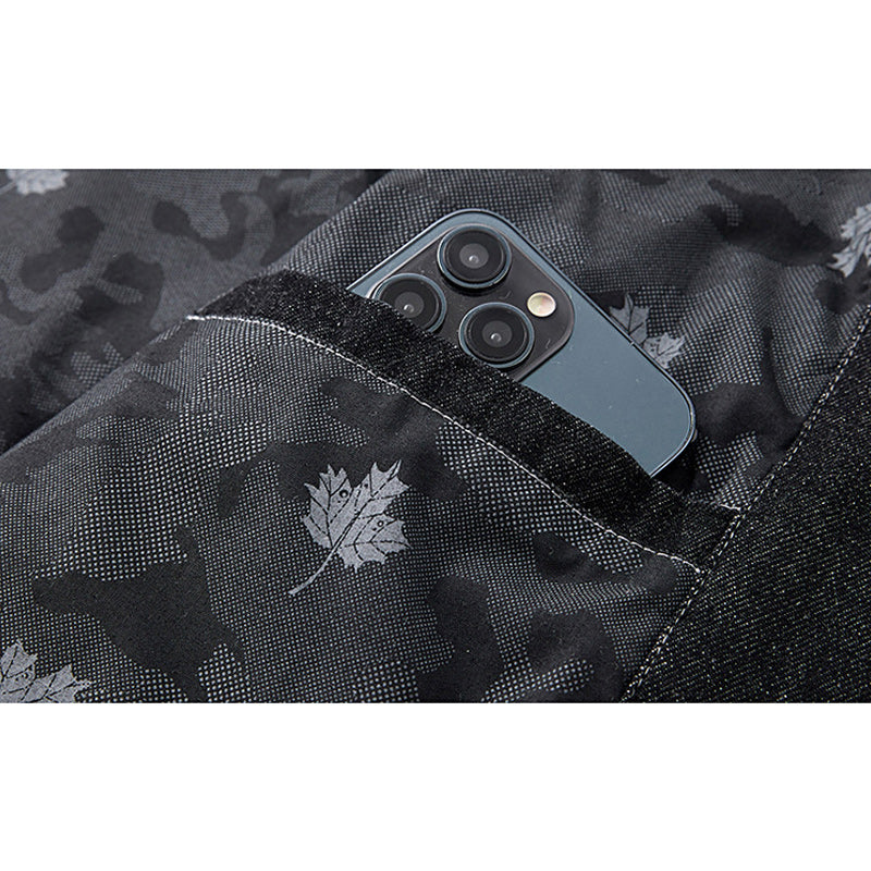 Distressed denim flight jacket with a maple leaf pattern on the back and motorcycle embroidery