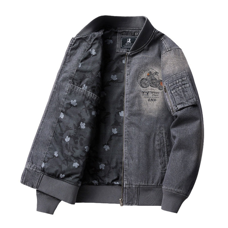Distressed denim flight jacket with a maple leaf pattern on the back and motorcycle embroidery