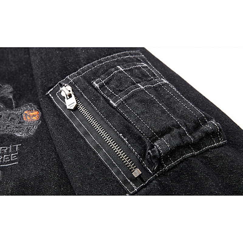 Distressed denim flight jacket with a maple leaf pattern on the back and motorcycle embroidery