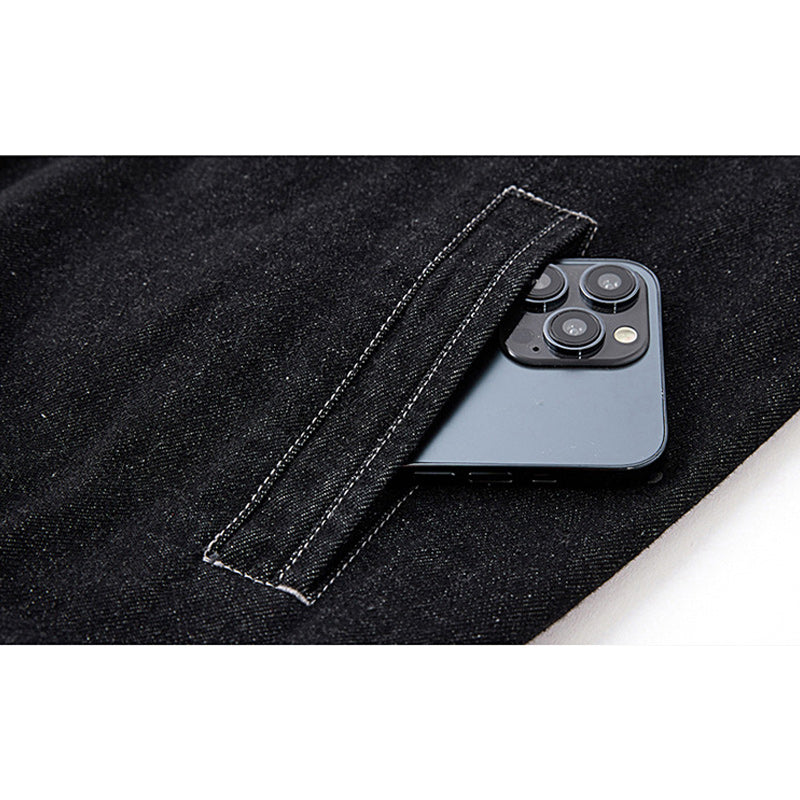 Distressed denim flight jacket with a maple leaf pattern on the back and motorcycle embroidery