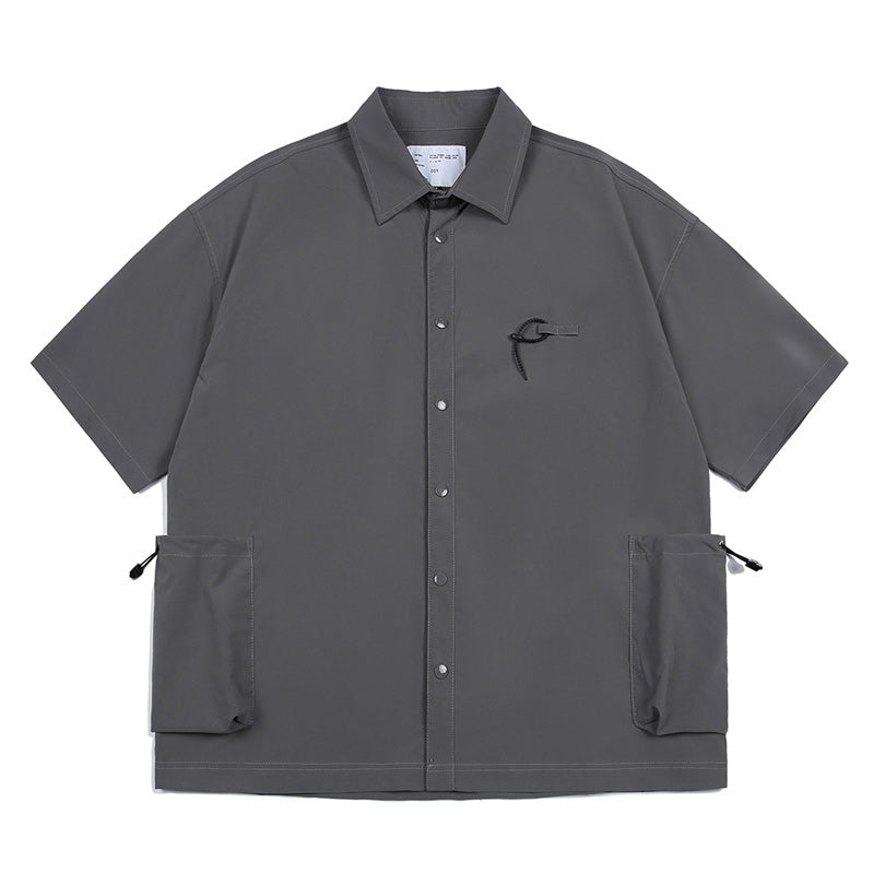 Solid color short sleeve shirt with pockets on both sides