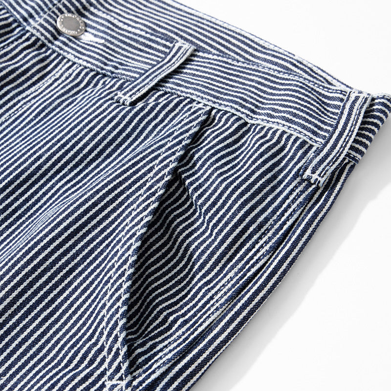 Multi-pocket work pants available in two styles: raw denim and striped denim
