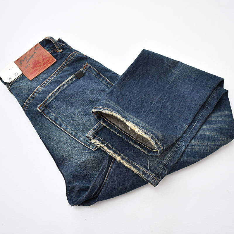 Straight denim pants with whiskered and distressed hem