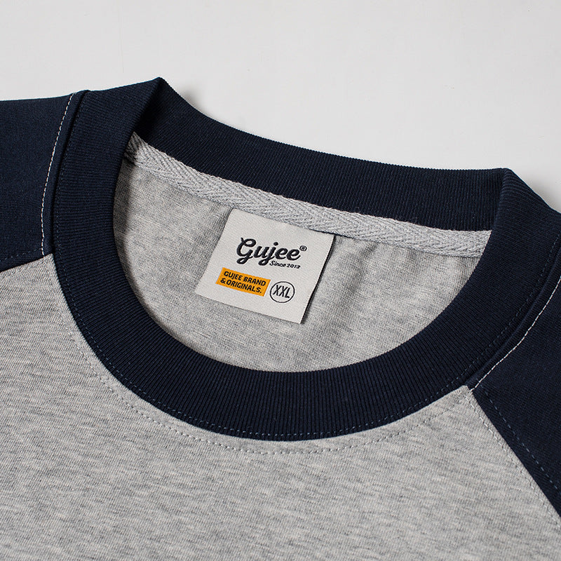 Color-coordinated embroidered raglan sleeve short-sleeved T-shirt