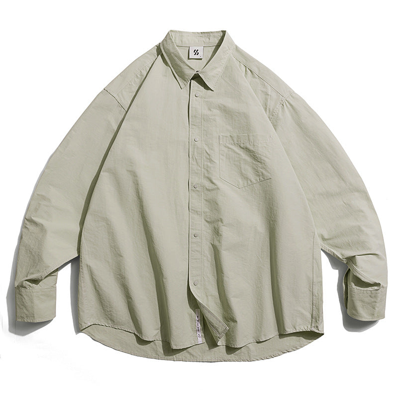 Choose from three colors of solid color irregular pocket long sleeve shirt