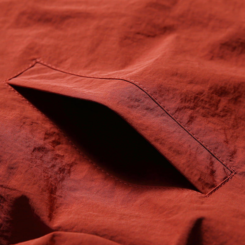 Color-coordinated irregular zipper hooded jacket