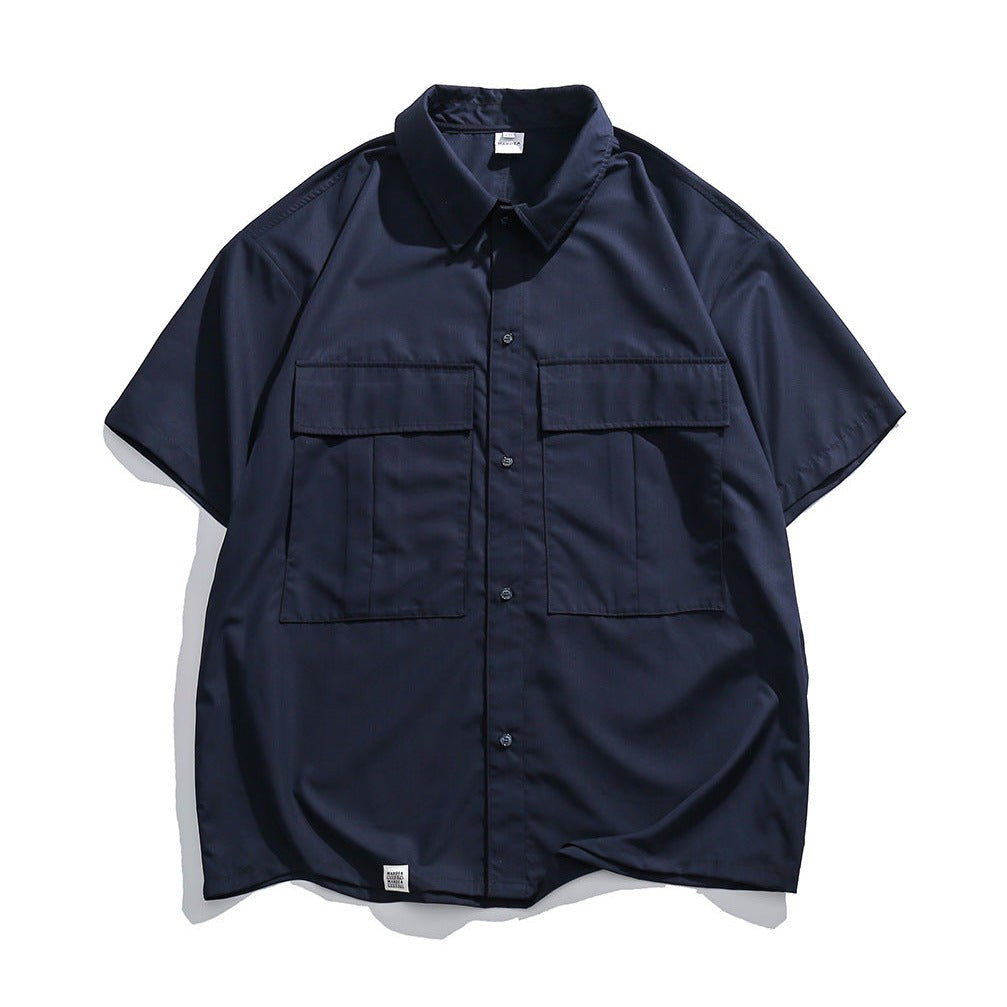 Choose from three colors. Solid color short-sleeved work shirt with pocket.