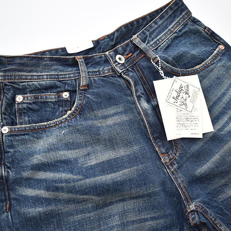 Straight denim pants with whiskered and distressed hem