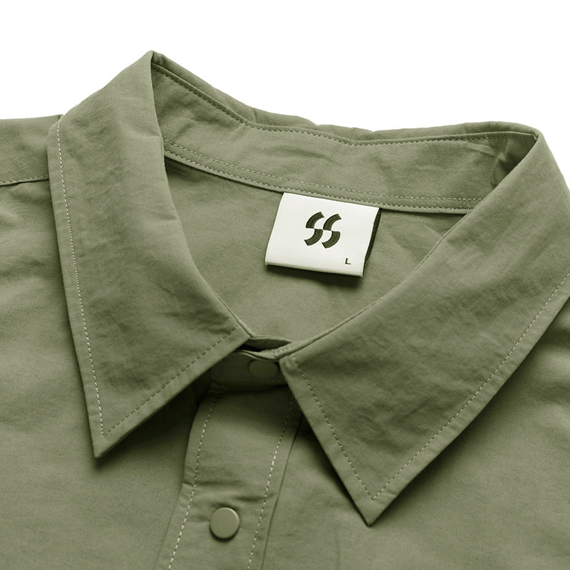Choose from three colors of solid color irregular pocket long sleeve shirt