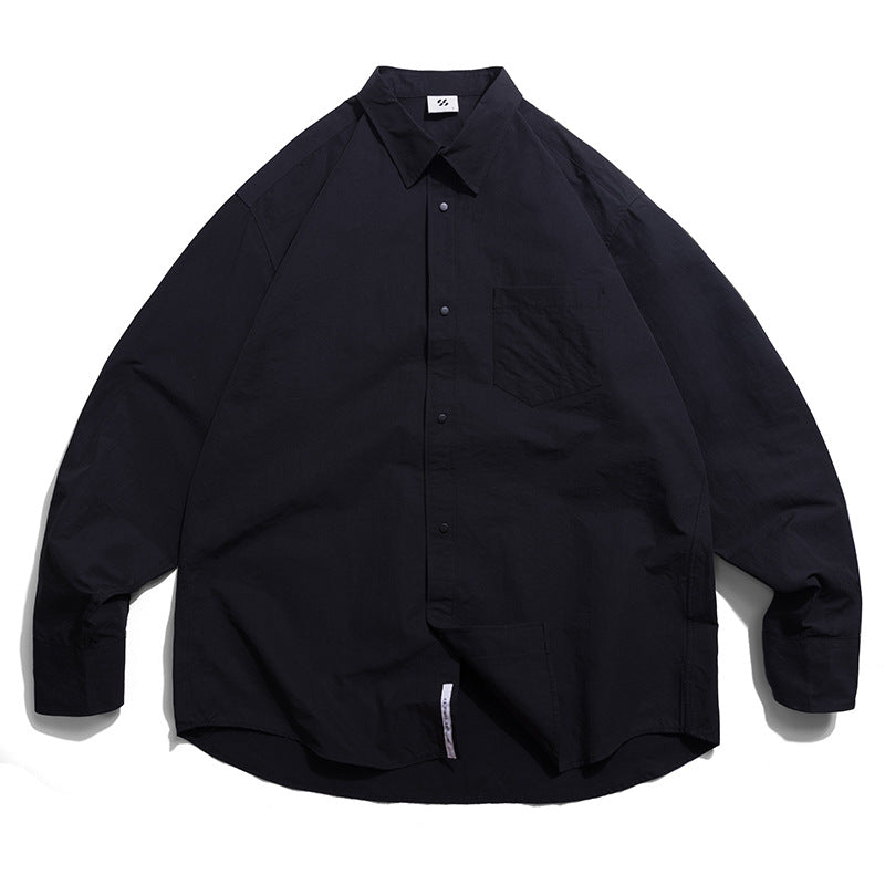 Choose from three colors of solid color irregular pocket long sleeve shirt