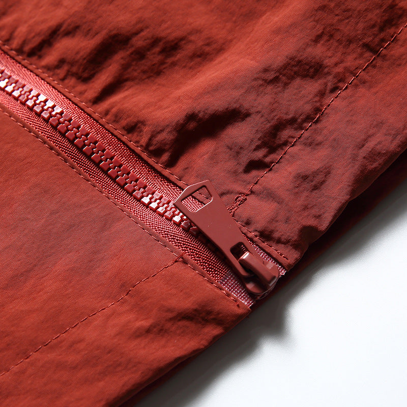 Color-coordinated irregular zipper hooded jacket