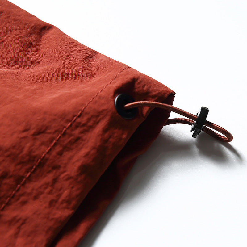 Color-coordinated irregular zipper hooded jacket