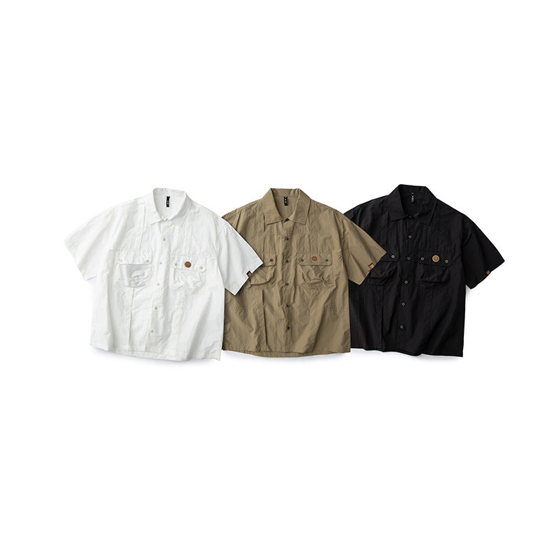 Plain short-sleeved work shirt with functional pockets