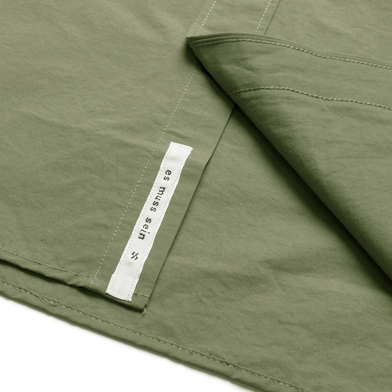 Choose from three colors of solid color irregular pocket long sleeve shirt