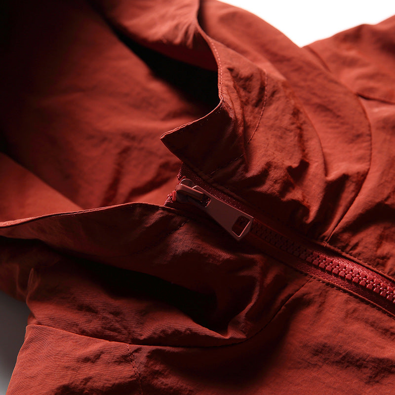 Color-coordinated irregular zipper hooded jacket