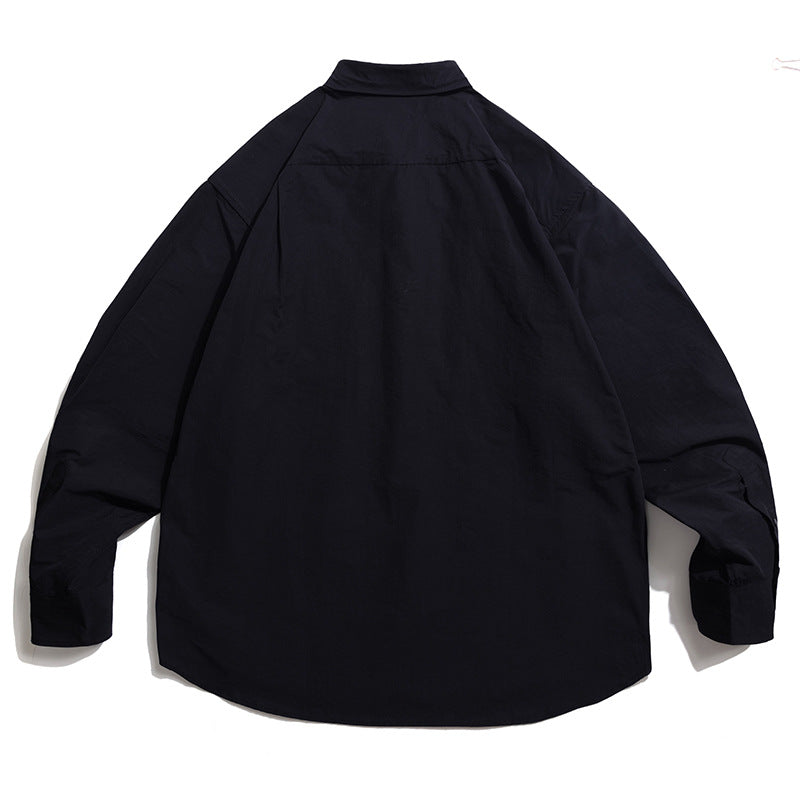 Choose from three colors of solid color irregular pocket long sleeve shirt