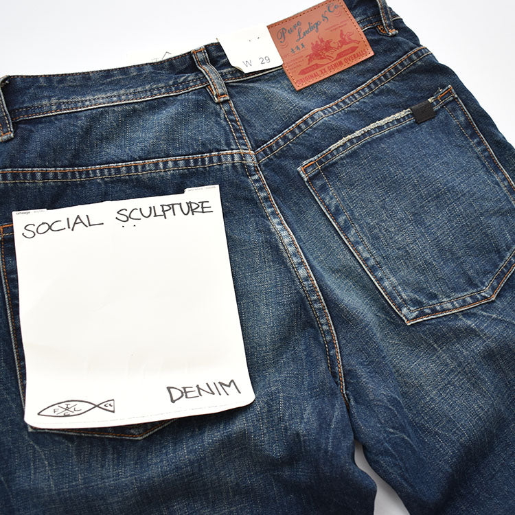 Straight denim pants with whiskered and distressed hem