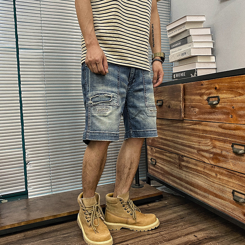 Distressed washed denim shorts