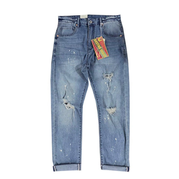 Painted and distressed washed red selvedge denim pants