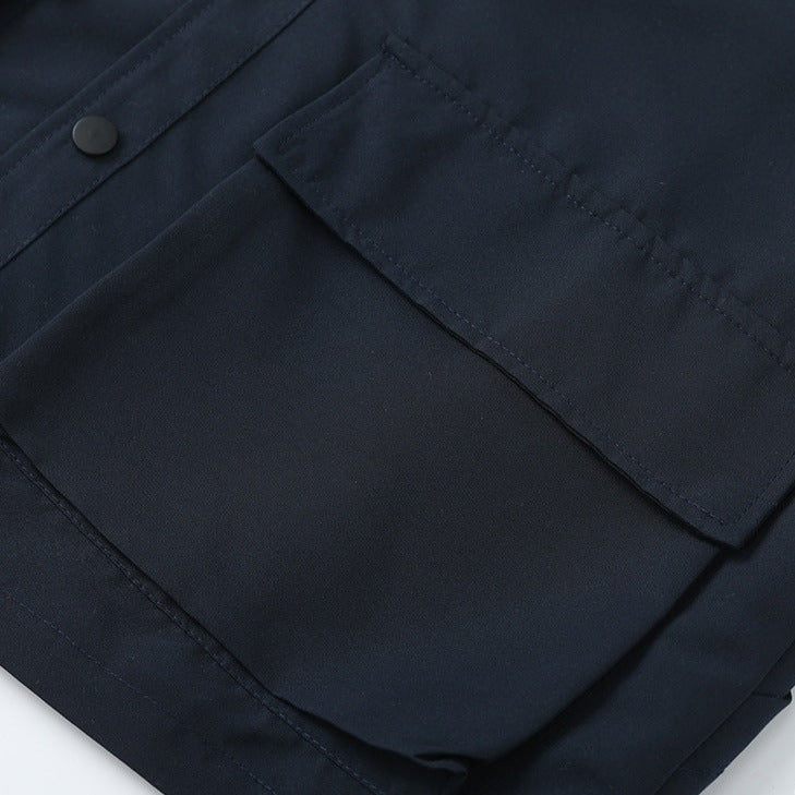 Three-dimensional pocket work vest with Velcro badge