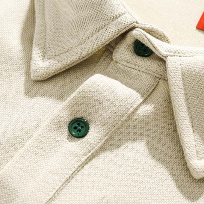 Faux layered colored polo shirt with embroidered hem