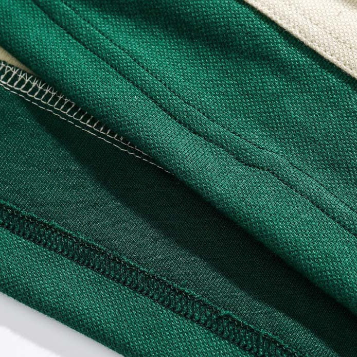 Faux layered colored polo shirt with embroidered hem
