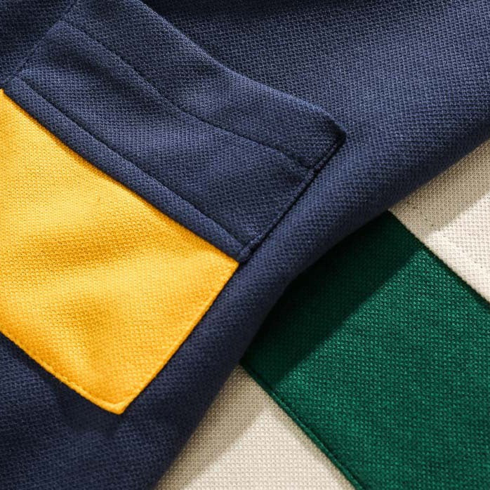 Faux layered colored polo shirt with embroidered hem