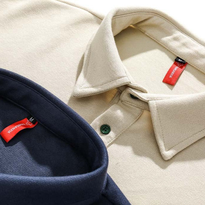 Faux layered colored polo shirt with embroidered hem
