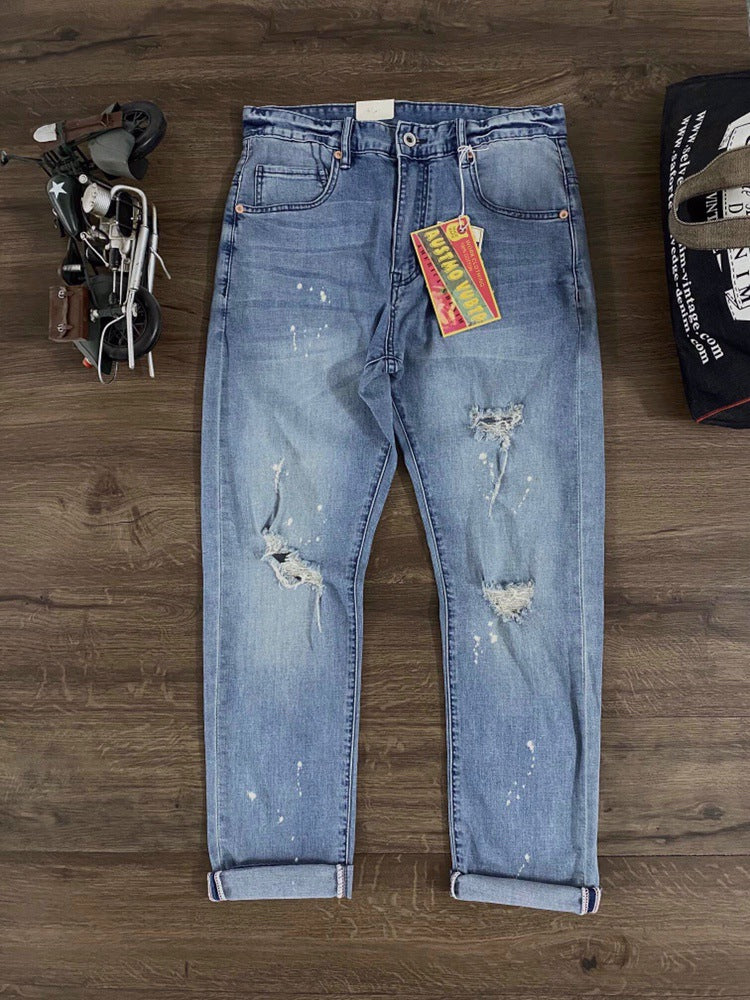 Painted and distressed washed red selvedge denim pants